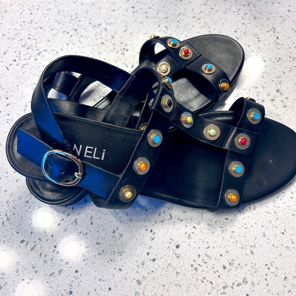 Vaneli Bella black leather sandals with gold accents and colored accent jewels.